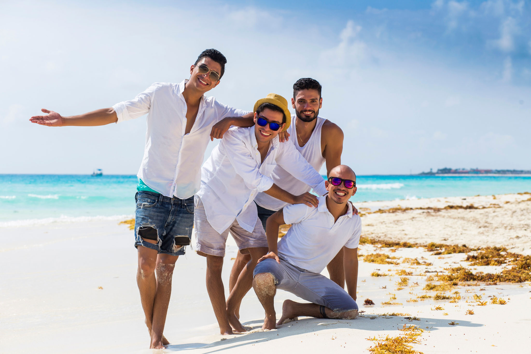 An image of friends on the beach celebrating a groom-to-be!
