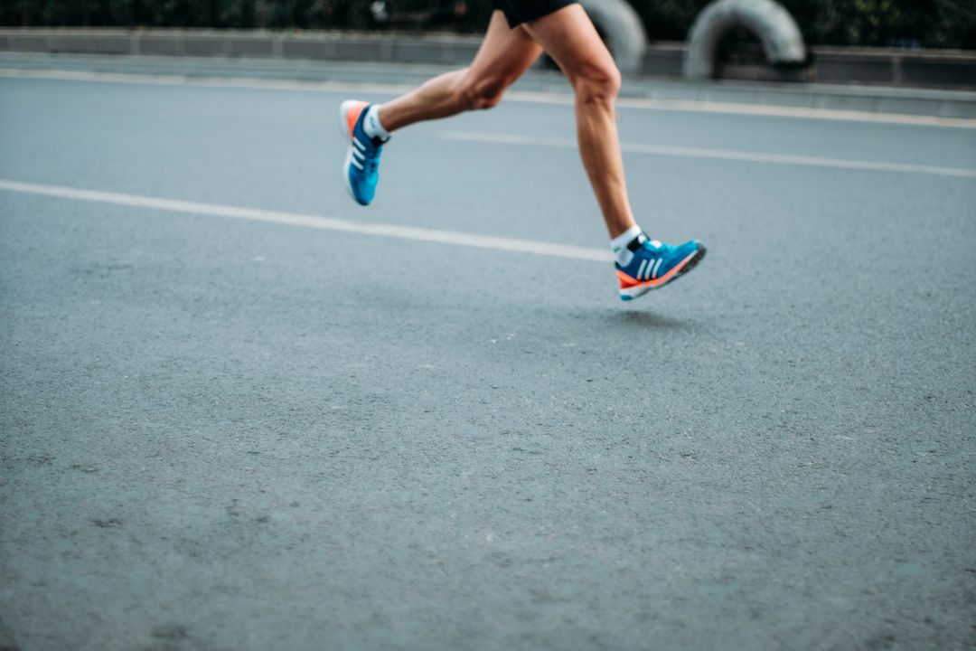 A person running - learn how to train and recover better with your local area IV therapy for athletes.