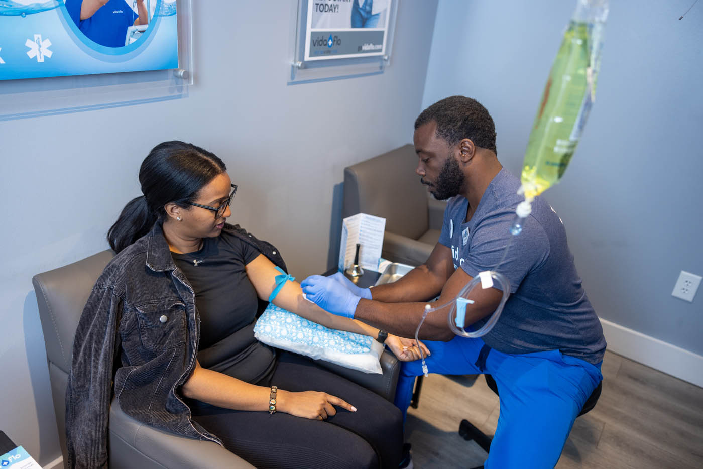 A person recieving IV hydration at Vida-Flo.