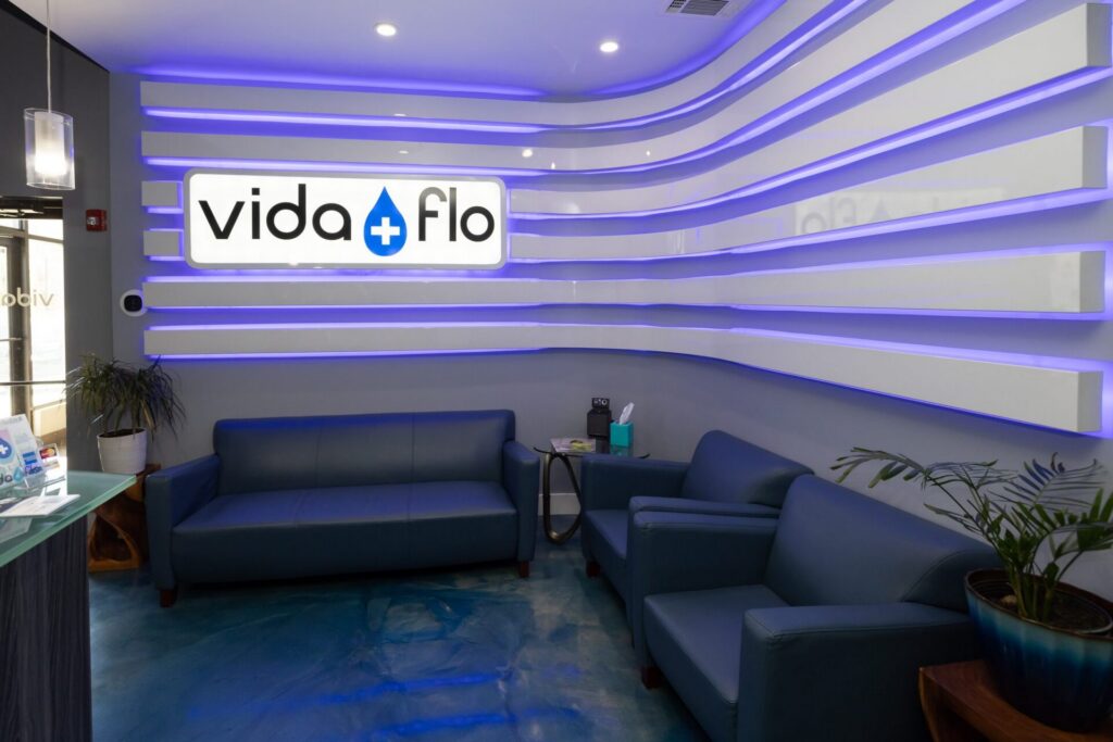 Vida-Flo clinic lounge with blue lighting and seating