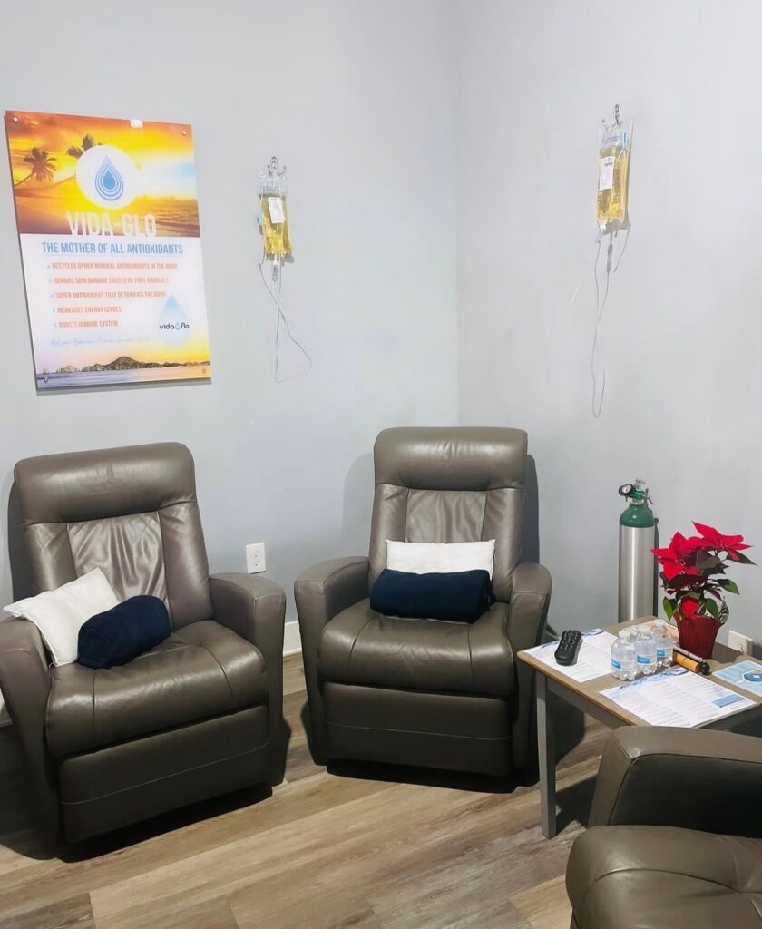 Leather recliners and IV drips in a treatment room at Vida-Flo Johns Creek