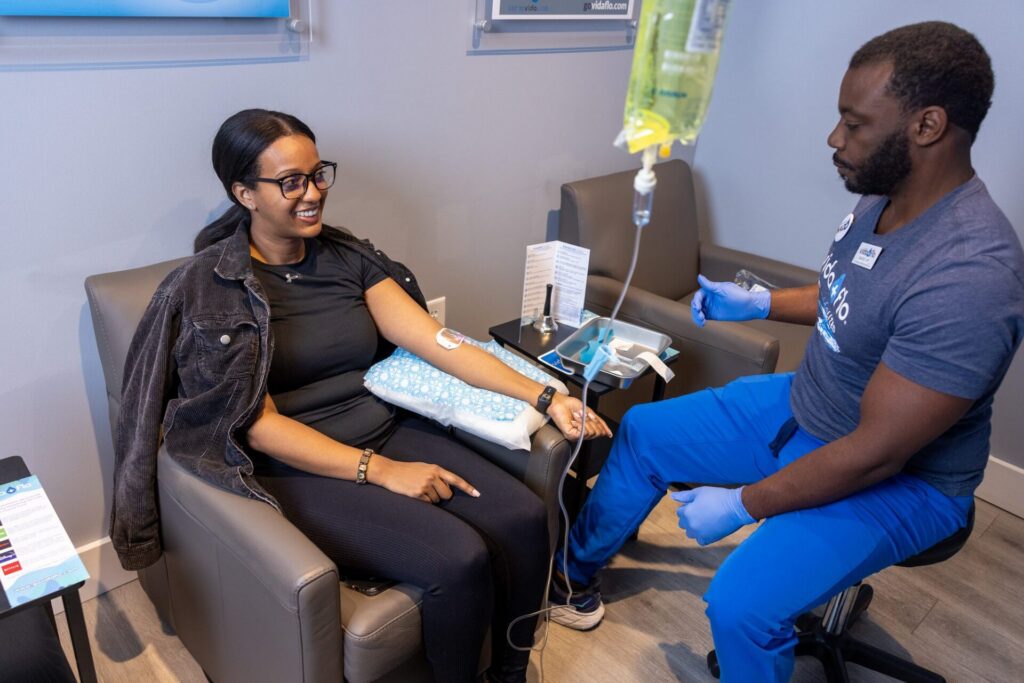 Vida-Flo nurse caring for a guest during an IV hydration treatment