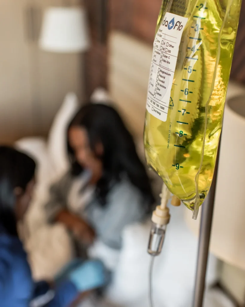 IV bag hanging beside a guest during a Vida-Flo treatment